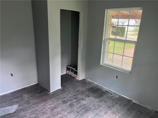 99 White St, Hammond, LA 70403 - unfurnished bedroom with dark wood-style flooring and baseboards