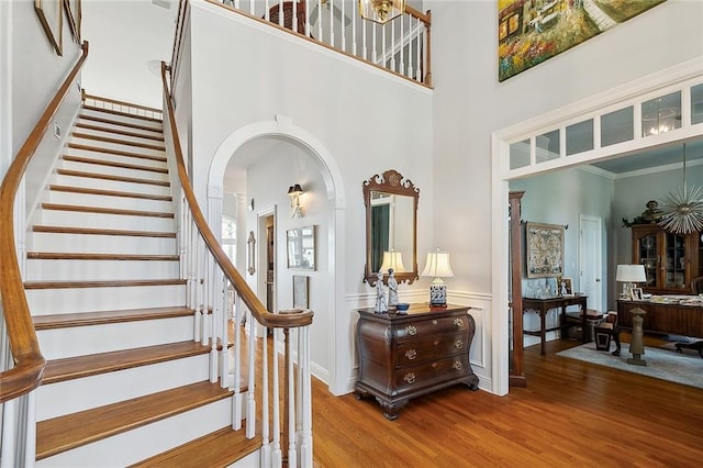 279 Debbie Dr, Slidell, LA 70458 - stairway featuring wood finished floors, arched walkways, and a high ceiling