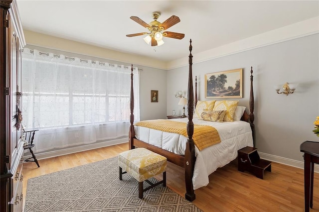 279 Debbie Dr, Slidell, LA 70458 - bedroom with light wood-style flooring, baseboards, and a ceiling fan