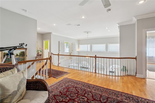 279 Debbie Dr, Slidell, LA 70458 - living area featuring crown molding, wood finished floors, a ceiling fan, an upstairs landing, and recessed lighting
