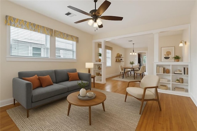 2609 General Pershing St, New Orleans, LA 70115 - living room with plenty of natural light, light wood-type flooring, ceiling fan, and baseboards