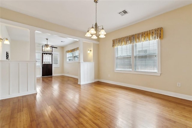 2609 General Pershing St, New Orleans, LA 70115 - empty room featuring a chandelier, light wood-style flooring, a ceiling fan, and baseboards