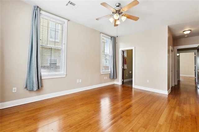 2609 General Pershing St, New Orleans, LA 70115 - empty room with a ceiling fan, wood finished floors, and baseboards