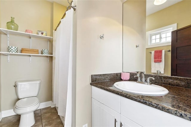 2609 General Pershing St, New Orleans, LA 70115 - full bathroom with toilet, vanity, tile patterned flooring, baseboards, and a shower with shower curtain
