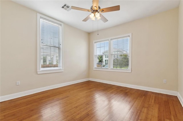 2609 General Pershing St, New Orleans, LA 70115 - spare room featuring baseboards, hardwood / wood-style flooring, and ceiling fan