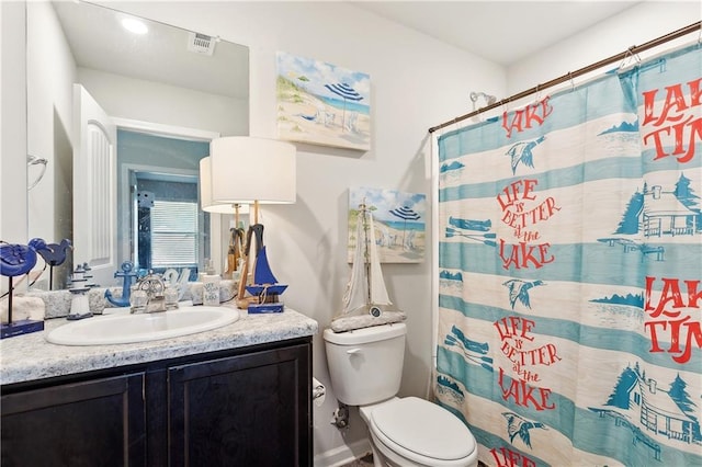 18181 Fox Hollow Loop, Hammond, LA 70401 - full bathroom featuring vanity, toilet, and a shower with curtain