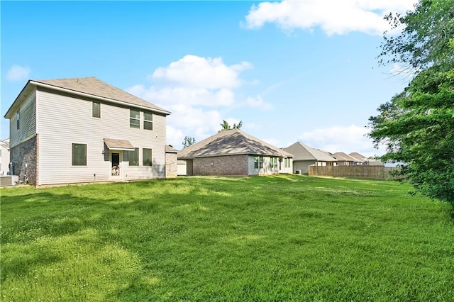 18181 Fox Hollow Loop, Hammond, LA 70401 - back of house featuring a lawn