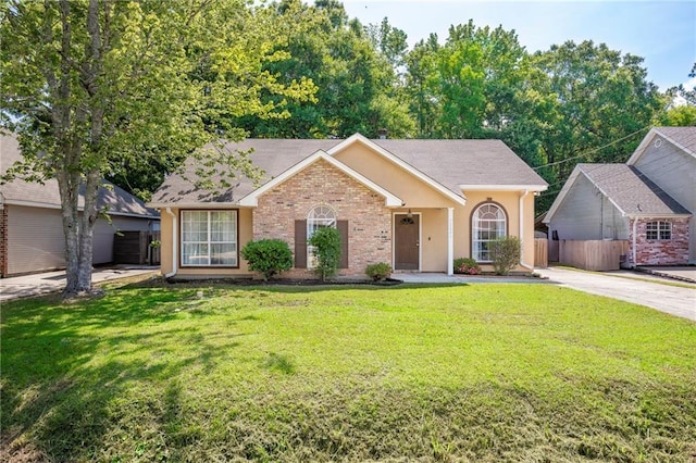 70046 9th St, Covington, LA 70433 - single story home with a shingled roof, concrete driveway, and stucco siding