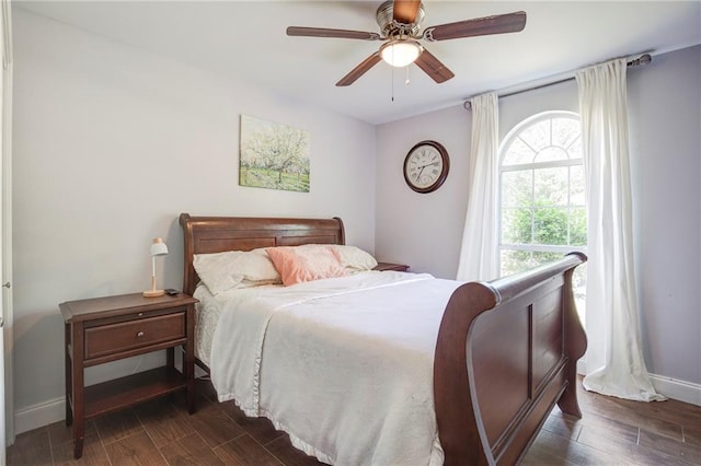 70046 9th St, Covington, LA 70433 - bedroom with dark wood-type flooring, baseboards, and a ceiling fan