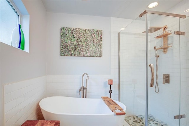 70046 9th St, Covington, LA 70433 - bathroom with a soaking tub, tile walls, a stall shower, and recessed lighting