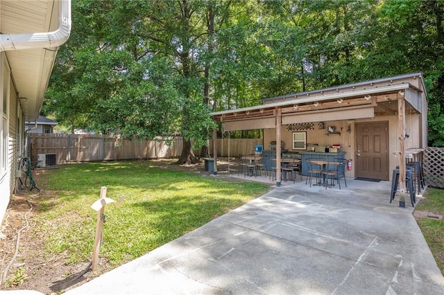 70046 9th St, Covington, LA 70433 - view of yard with a patio area and central air condition unit