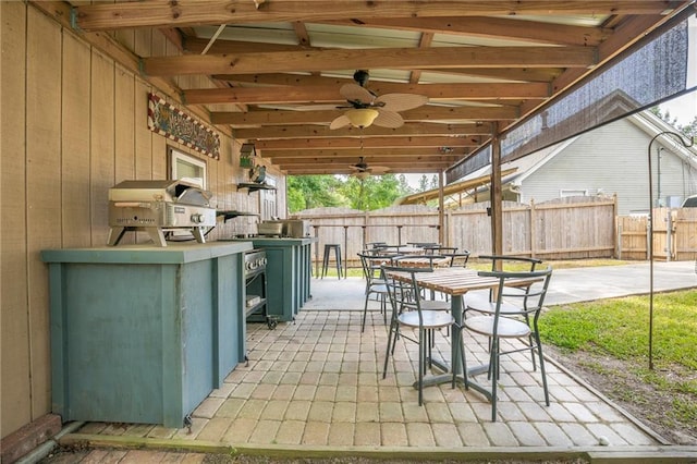 70046 9th St, Covington, LA 70433 - view of patio with area for grilling and ceiling fan