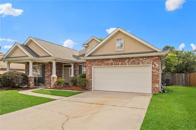 526 Moore Blvd, Covington, LA 70433 - view of front of house featuring stucco siding, concrete driveway, central air condition unit, and brick siding