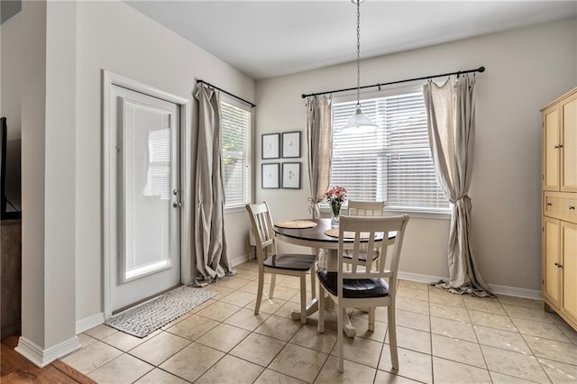 526 Moore Blvd, Covington, LA 70433 - dining room with light tile patterned flooring and baseboards