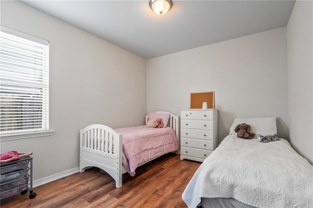 526 Moore Blvd, Covington, LA 70433 - bedroom featuring multiple windows, wood finished floors, and baseboards
