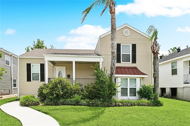 6409 Louis Xiv St, New Orleans, LA 70124 - view of front of property with a front lawn and a standing seam roof