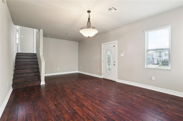 6409 Louis Xiv St, New Orleans, LA 70124 - unfurnished living room featuring hardwood / wood-style flooring, baseboards, and stairway