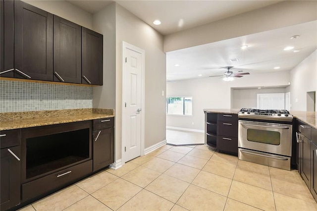 6409 Louis Xiv St, New Orleans, LA 70124 - kitchen featuring stainless steel range with gas stovetop, dark brown cabinets, backsplash, and recessed lighting