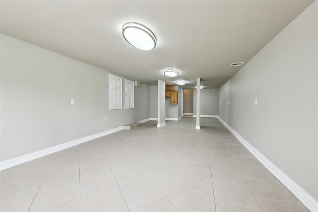 6409 Louis Xiv St, New Orleans, LA 70124 - finished basement featuring light tile patterned floors and baseboards