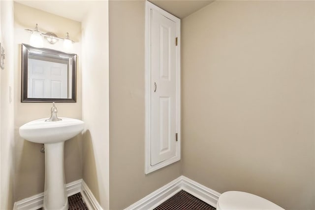 6409 Louis Xiv St, New Orleans, LA 70124 - bathroom with toilet, baseboards, and tile patterned flooring