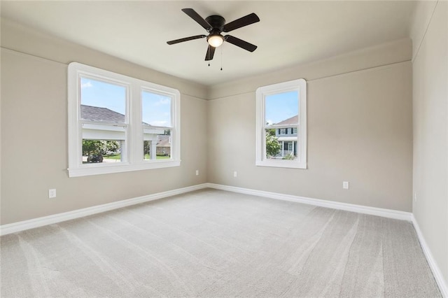 6409 Louis Xiv St, New Orleans, LA 70124 - unfurnished room featuring light colored carpet, baseboards, and a ceiling fan