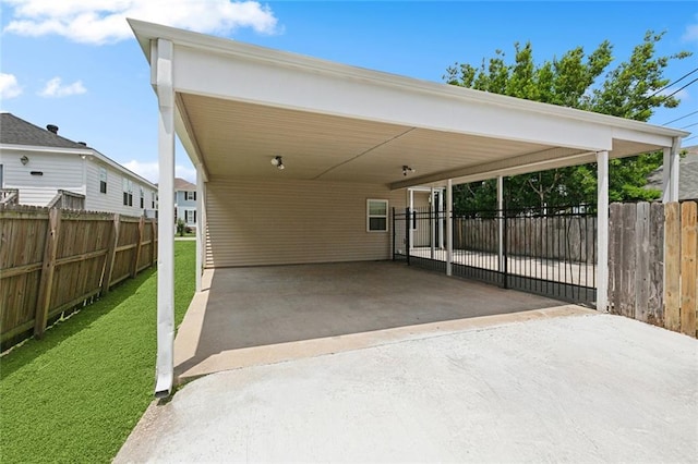 6409 Louis Xiv St, New Orleans, LA 70124 - view of patio / terrace featuring driveway and a carport