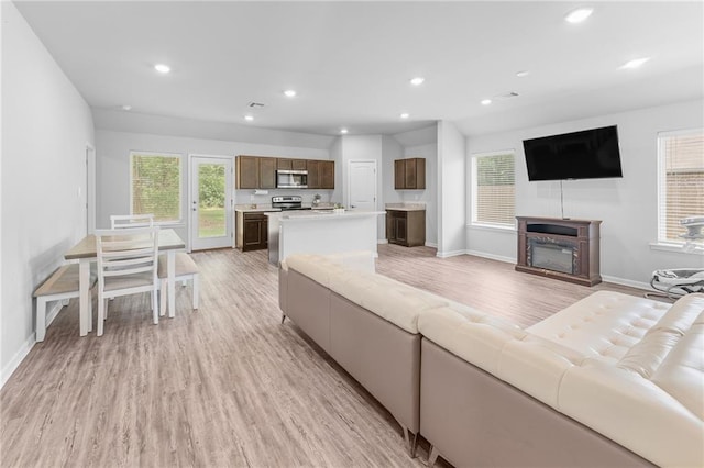 18349 Fox Hollow Loop, Hammond, LA 70401 - living room with baseboards, light wood-style floors, healthy amount of natural light, and recessed lighting