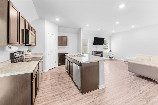 18349 Fox Hollow Loop, Hammond, LA 70401 - kitchen with stainless steel appliances, a sink, open floor plan, light wood-style flooring, and recessed lighting