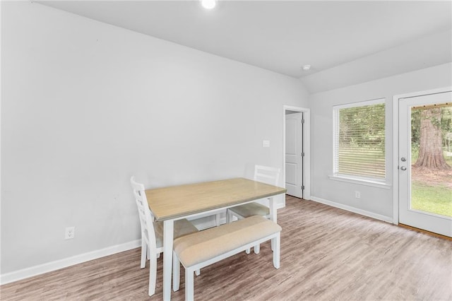 18349 Fox Hollow Loop, Hammond, LA 70401 - dining area featuring baseboards, wood finished floors, and lofted ceiling