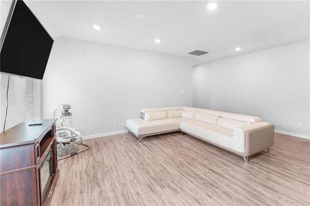 18349 Fox Hollow Loop, Hammond, LA 70401 - living area with light wood finished floors, baseboards, recessed lighting, and lofted ceiling