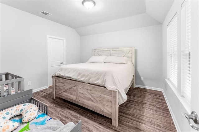 18349 Fox Hollow Loop, Hammond, LA 70401 - bedroom featuring wood finished floors, lofted ceiling, and baseboards