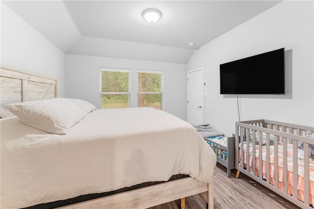 18349 Fox Hollow Loop, Hammond, LA 70401 - bedroom featuring wood finished floors and vaulted ceiling