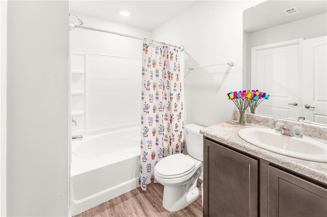 18349 Fox Hollow Loop, Hammond, LA 70401 - bathroom featuring wood finished floors, vanity, toilet, and shower / bath combination with curtain