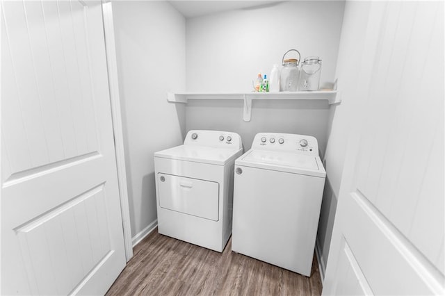 18349 Fox Hollow Loop, Hammond, LA 70401 - washroom featuring independent washer and dryer and wood finished floors