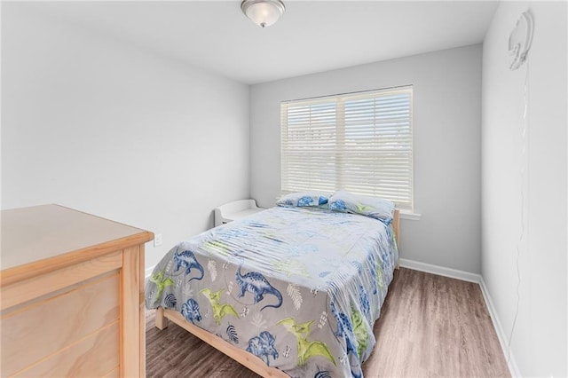 18349 Fox Hollow Loop, Hammond, LA 70401 - bedroom with wood finished floors and baseboards