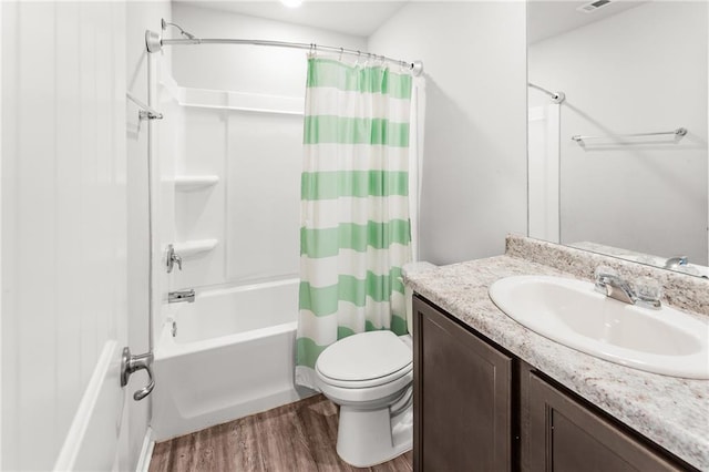 18349 Fox Hollow Loop, Hammond, LA 70401 - bathroom with wood finished floors, vanity, shower / bath combo, and toilet