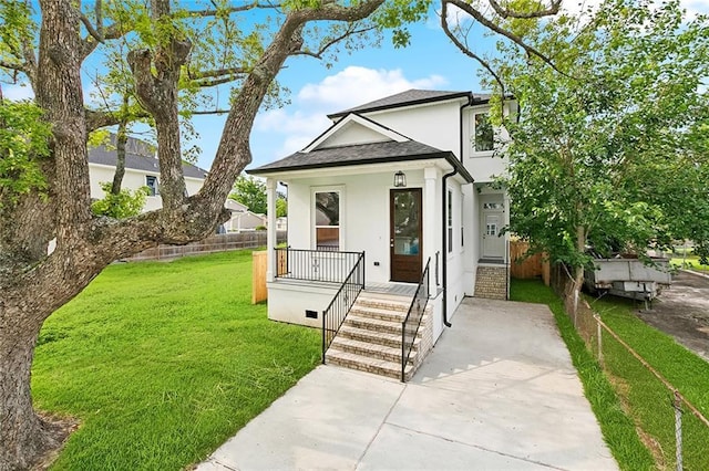 2824 Andover St, Jefferson, LA 70121 - view of front of home with stucco siding, covered porch, and roof with shingles