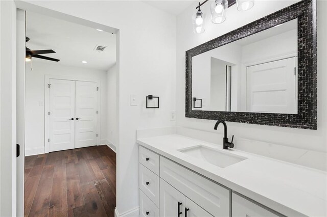 2824 Andover St, Jefferson, LA 70121 - bathroom with vanity, hardwood / wood-style floors, ceiling fan, baseboards, and recessed lighting