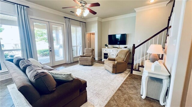 983 Lakeshore Blvd, Slidell, LA 70461 - living area featuring french doors, stairs, ceiling fan, crown molding, and tile patterned flooring
