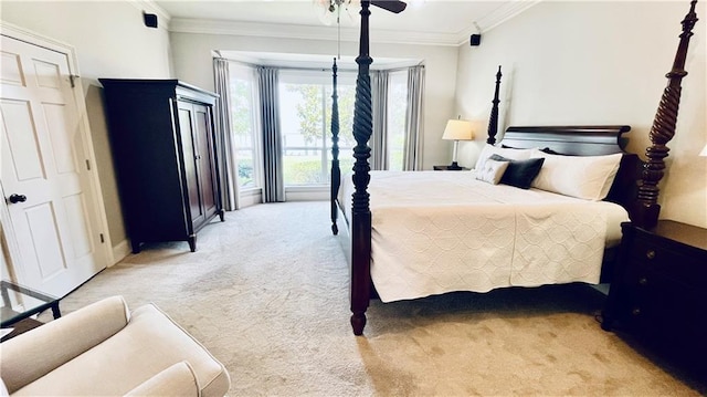 983 Lakeshore Blvd, Slidell, LA 70461 - bedroom featuring light carpet, ornamental molding, and baseboards