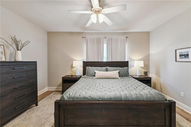 983 Lakeshore Blvd, Slidell, LA 70461 - bedroom with baseboards, light wood-style flooring, and a ceiling fan