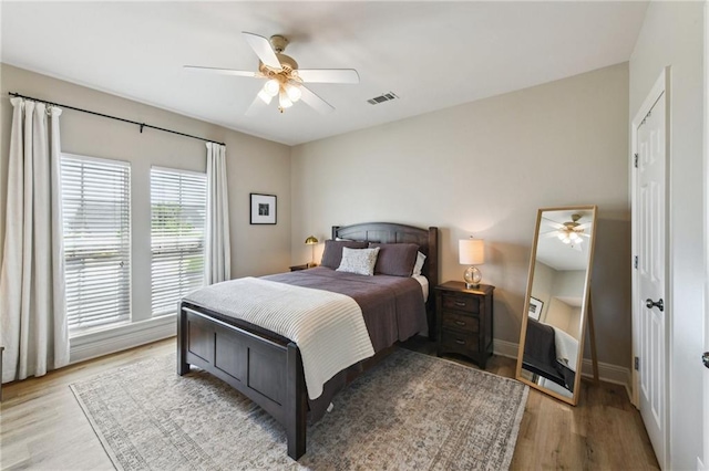 983 Lakeshore Blvd, Slidell, LA 70461 - bedroom featuring light wood-type flooring, a ceiling fan, and baseboards