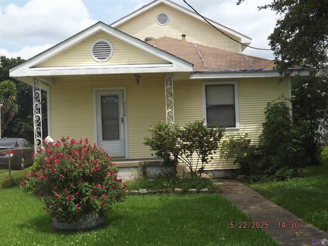 725 Chipley St, Westwego, LA 70094 - view of front facade featuring a porch and a front yard