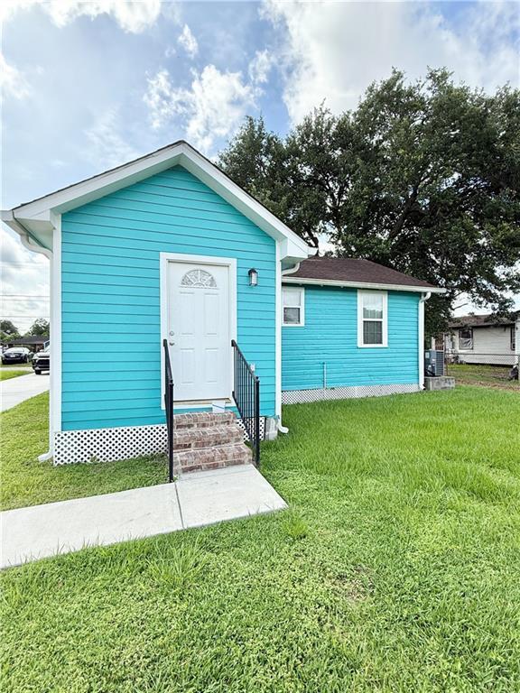 2012 Walkers Ln, Meraux, LA 70075 - view of outbuilding with entry steps