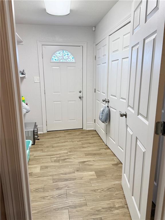 2012 Walkers Ln, Meraux, LA 70075 - laundry room with light wood finished floors