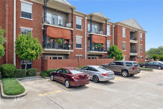801 Rue Burgundy St Unit 113, Metairie, LA 70005 - view of building exterior featuring uncovered parking