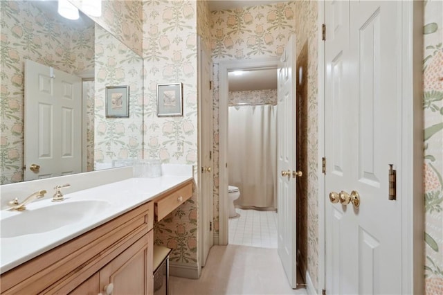801 Rue Burgundy St Unit 113, Metairie, LA 70005 - full bath with wallpapered walls, vanity, toilet, tile patterned floors, and curtained shower