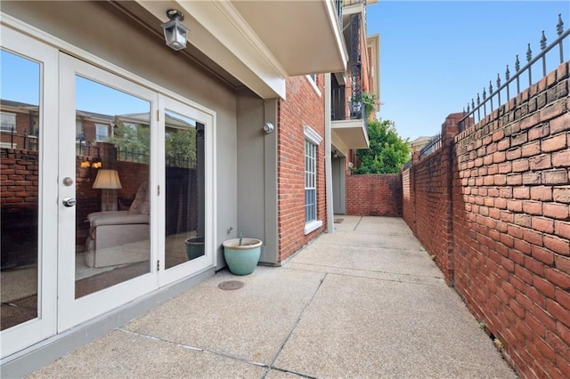 801 Rue Burgundy St Unit 113, Metairie, LA 70005 - fenced backyard with a patio area and french doors