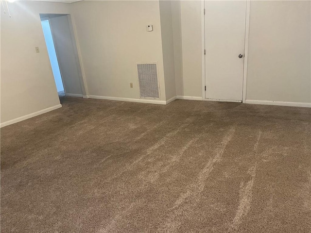 4813 Lake Como Ave, Metairie, LA 70006 - empty room with dark colored carpet and baseboards