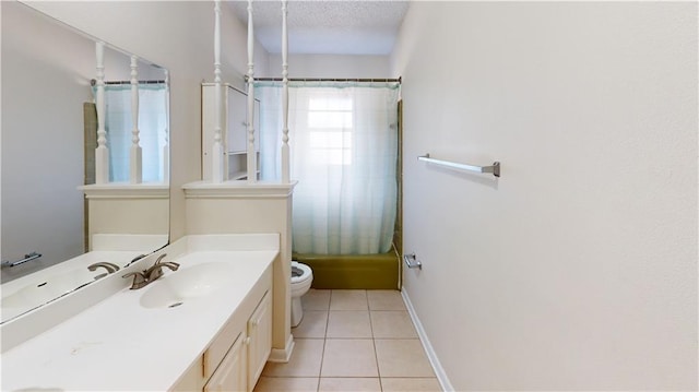 4813 Lake Como Ave, Metairie, LA 70006 - bathroom with toilet, vanity, tile patterned floors, shower / bath combo with shower curtain, and a textured ceiling
